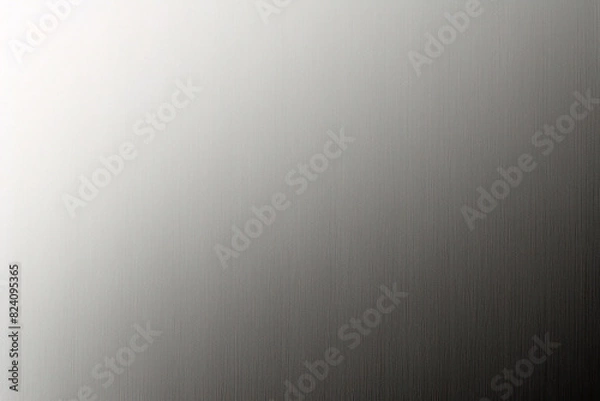 Fototapeta A tight shot of a polished metal surface adorned with a silver pattern, overlain by silver metallic foil
