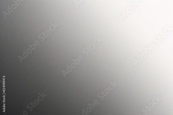 Fototapeta A tight shot of a polished metal surface adorned with a silver pattern, overlain by silver metallic foil
