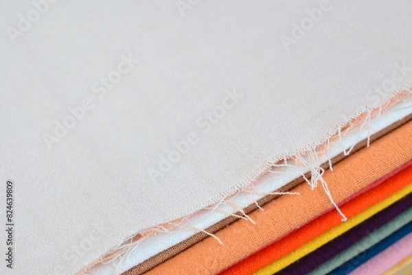 Obraz stack of colourful cotton clothes, close up pile of clothing
