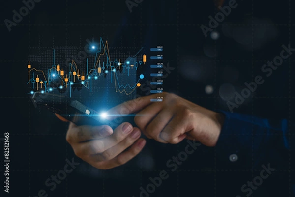 Obraz Businessman analyzing forex trading graph financial data. Business finance background.business finance technology and investment concept. Stock Market Investments Funds and Digital Assets.