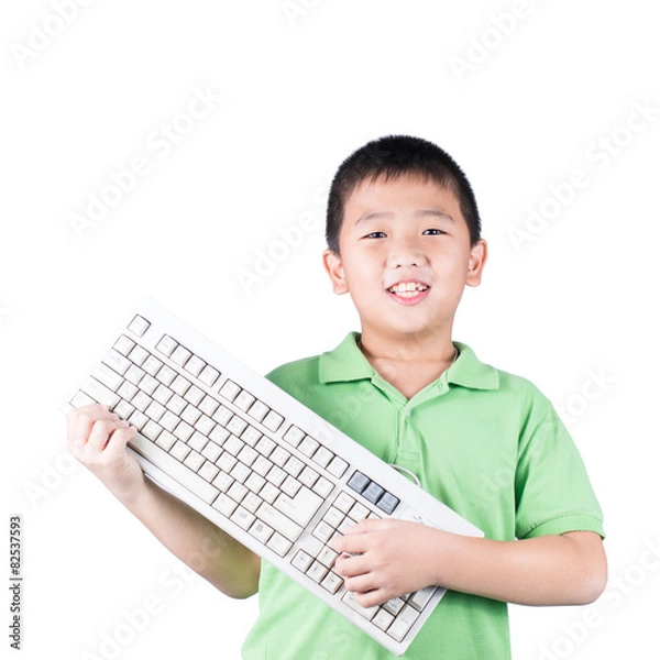 Fototapeta Cute boy with keyboard isolated on white background
