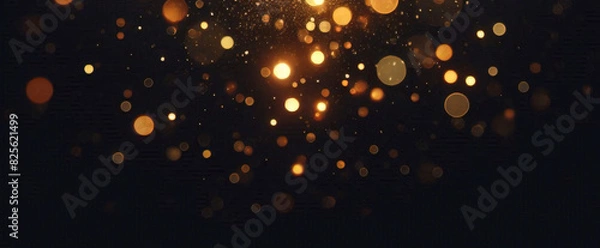 Obraz 抽象的な豪華なゴールドの背景に金の粒子。キラキラのビンテージ ライトの背景。クリスマスの黄金の光は、暗い背景に粒子のボケ味を輝かせます。金箔のテクスチャです。