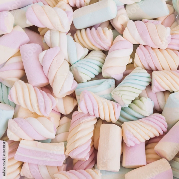 Fototapeta A delicious multicolored marshmallows background. Shallow depth