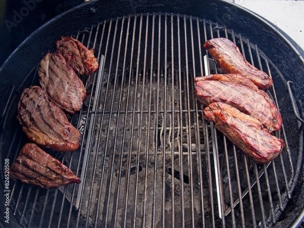 Obraz Sirloin cap steaks, also called picanha, smoked and grilled on the old-fashioned kettle charcoal grill