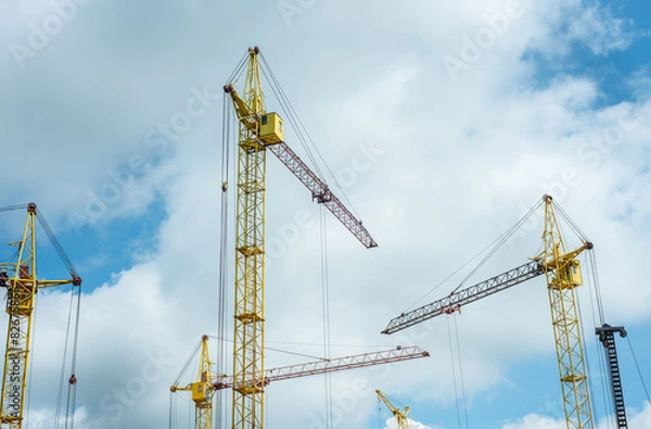 Fototapeta Construction site with cranes on the sky