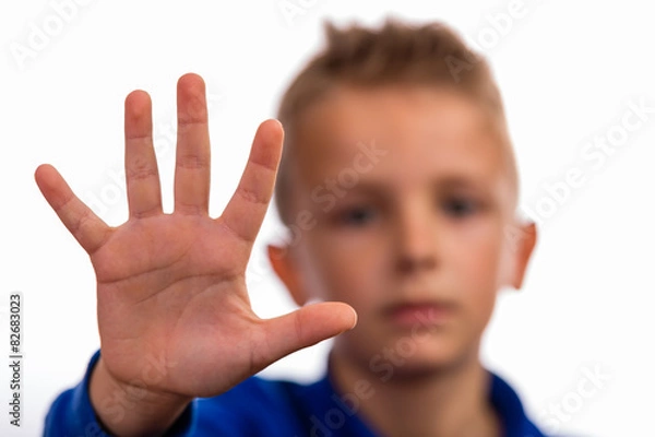 Obraz Boy with raised hand making stop gesture