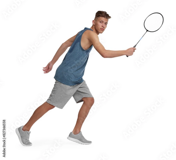 Fototapeta Young man playing badminton with racket on white background