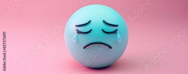 Fototapeta crying emoji on a soft pink background with space for copy The emoji is light blue with tears streaming down its face