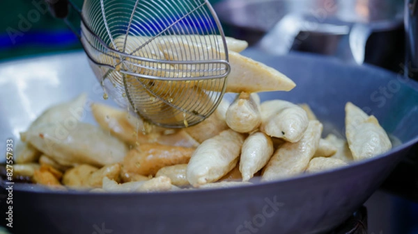 Fototapeta Food from the market is sold on the streets where people pass by. It is easy to buy and the price is cheap.