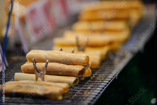 Fototapeta Food from the market is sold on the streets where people pass by. It is easy to buy and the price is cheap.