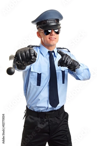 Fototapeta Policeman in sunglasses shows on you with nightstick