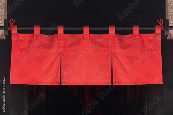 Fototapeta The curtain-like fabric that hangs in front of traditional Japanese restaurants and shops not only serves as a signboard, but holds a larger meaning,