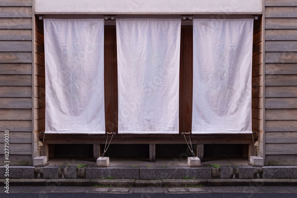 Fototapeta The curtain-like fabric that hangs in front of traditional Japanese restaurants and shops not only serves as a signboard, but holds a larger meaning,