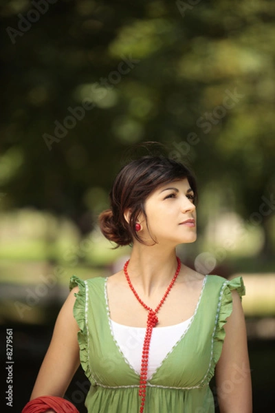 Fototapeta young lady looking at the nature with a peaceful face