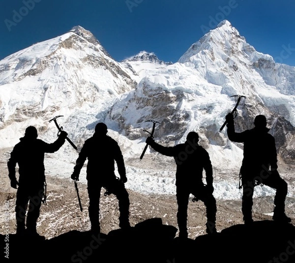 Fototapeta Silhouette of men with ice axe in hand, Mount Everest