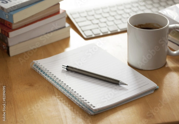 Obraz pen with notebook on working table