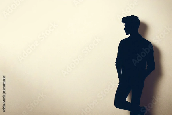 Fototapeta Silhouette of a young man on a clean background. Space for text.