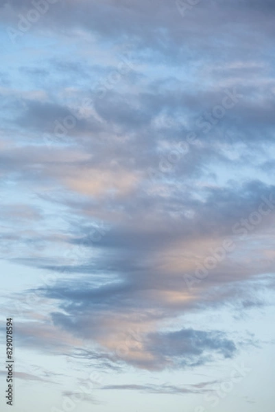 Fototapeta Sky at dusk, light blue sky with clouds in white, blue, and gray, as a nature background
