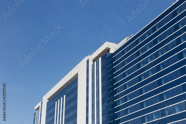Fototapeta glass building on a sky background