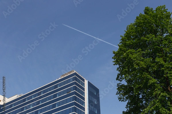 Fototapeta glass building and airplane