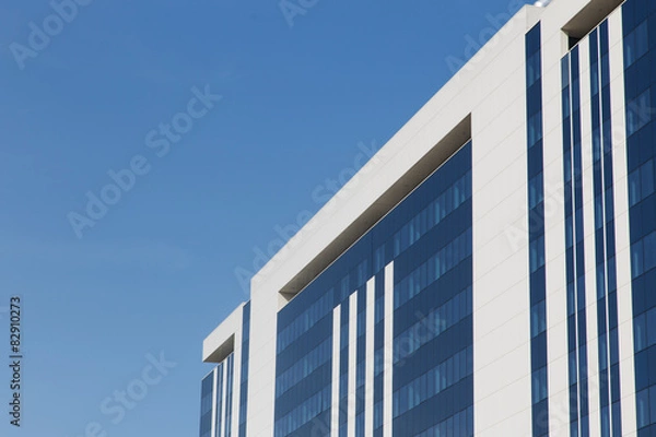 Fototapeta glass building on a sky background