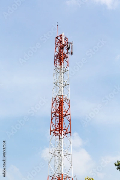 Obraz Telecommunication tower with cloudy sky.