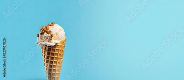 Fototapeta Blue background with copy space image of ice cream with a waffle