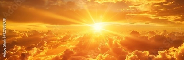 Obraz The sun shines through clouds with rays of light shining