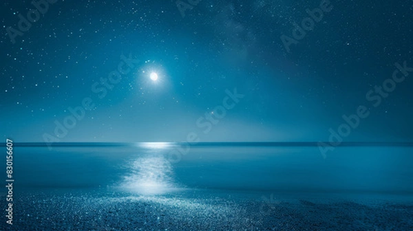 Fototapeta A photographic style of a sky and sea environment, clear night sky with bright stars and a full moon over a serene sea. The moonlight creates a shimmering path on the water's surface. Deep blue tones