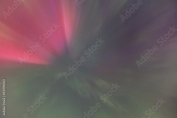 Fototapeta Night time skies light up in vibrant colors thanks to the Northern Lights over Washington state