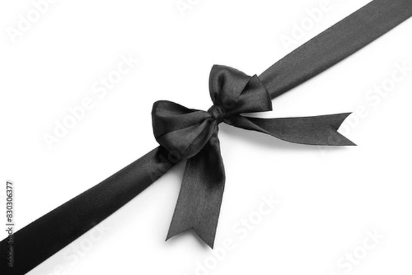 Fototapeta Black satin ribbon with bow isolated on white, top view