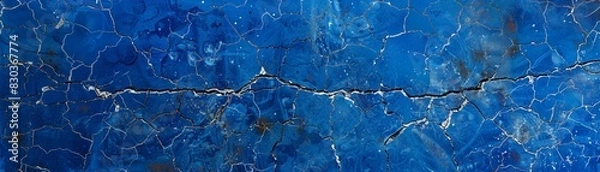 Obraz A deep cobalt blue background with a subtle crackle texture, aged paint or a weathered surface