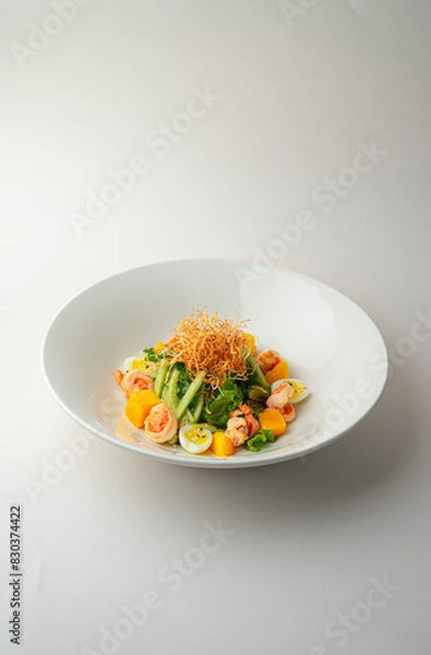 Fototapeta Warm shrimp salad on a white background