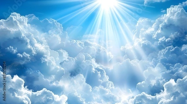 Fototapeta Bright day with sunlight peeking through large white clouds