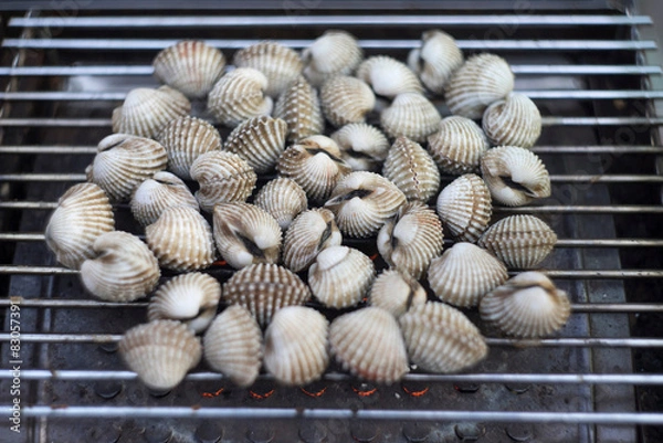 Fototapeta Cockles on flaming grill