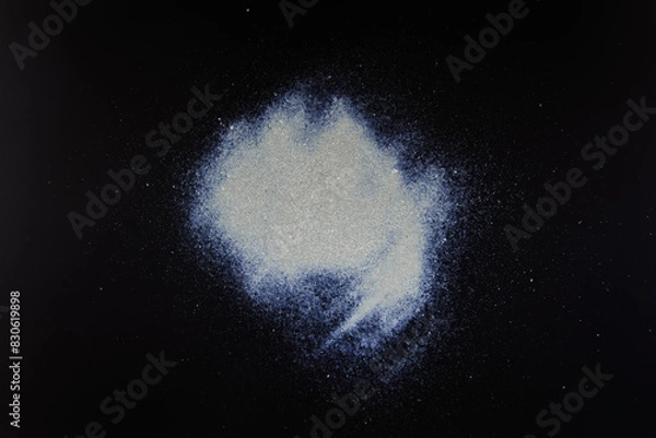 Obraz abstract white dust on a black background.