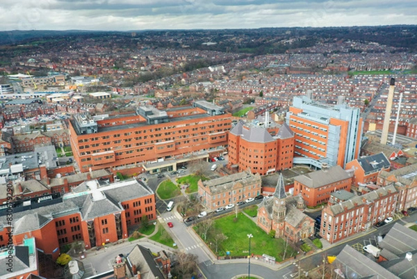 Fototapeta Aerial photo take in the town of Harehills in Leeds just outside the city centre, showing the St James's University Hospital known as Jimmy's with traffic and ambulances parked up at A and E entrance