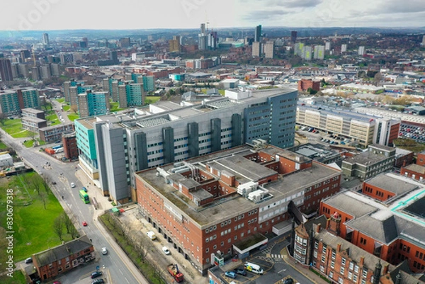 Fototapeta Aerial photo take in the town of Harehills in Leeds just outside the city centre, showing the St James's University Hospital known as Jimmy's with traffic and ambulances parked up at A and E entrance