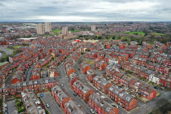 Fototapeta Aerial photo of the town of Kirkstall in Leeds West Yorkshire in the UK, showing a drone view of the suburban houses and neighbourhood from above on a sunny day in the autumn time