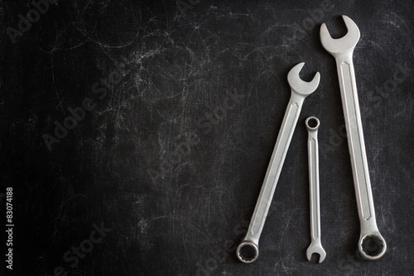 Fototapeta Set of 3 Wrenches on a Dark Textured Background