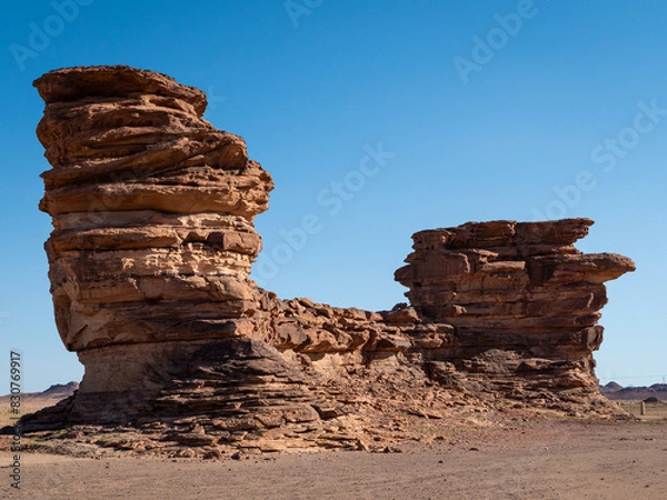 Fototapeta Weathered rock formations around Bajdah in the uniquely shaped landscape of Hisma mountain range in Tabuk Province, Saudi Arabia. Clear sky. Space for text.
