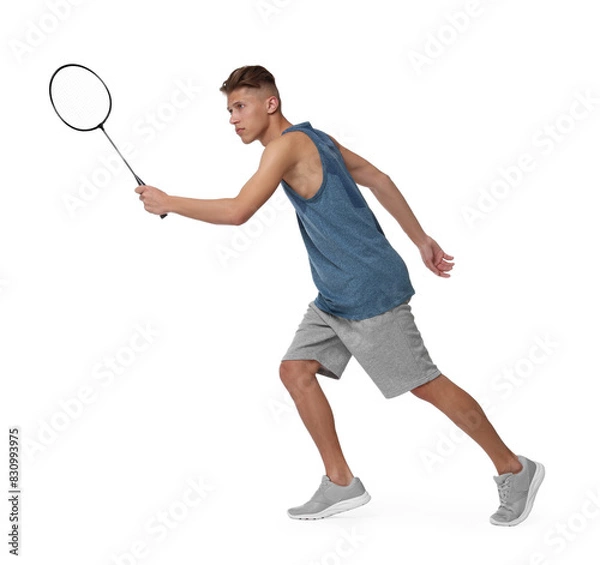 Fototapeta Young man playing badminton with racket on white background