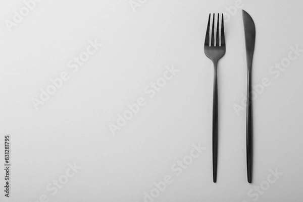 Fototapeta Stylish cutlery on grey table, top view. Space for text