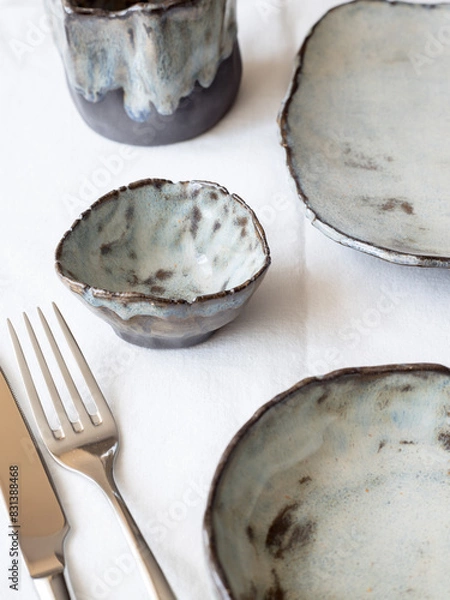 Obraz Serving. Author's ceramic tableware. Light background, top view.