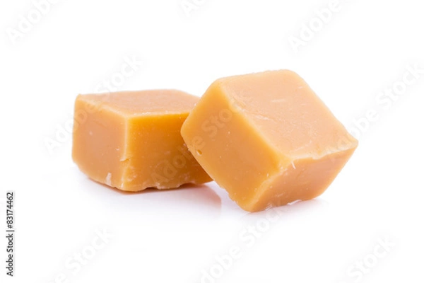 Fototapeta Tasty toffees on a white background.