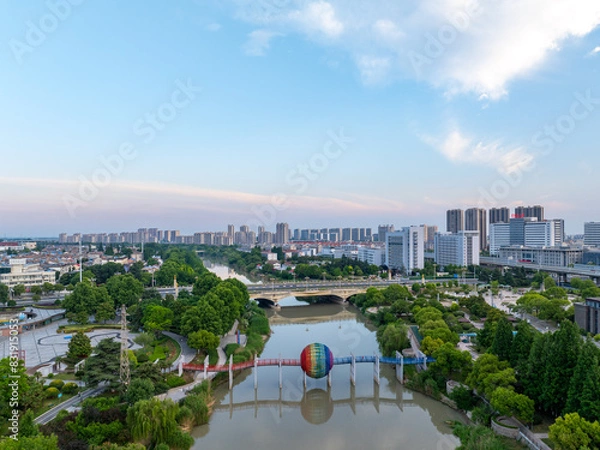 Fototapeta Huaian, Jiangsu Province: China's North-South boundary symbol park in the morning light