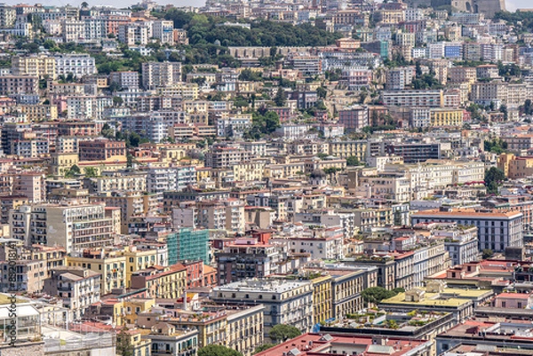 Fototapeta The many houses built on the hillside in Naples.