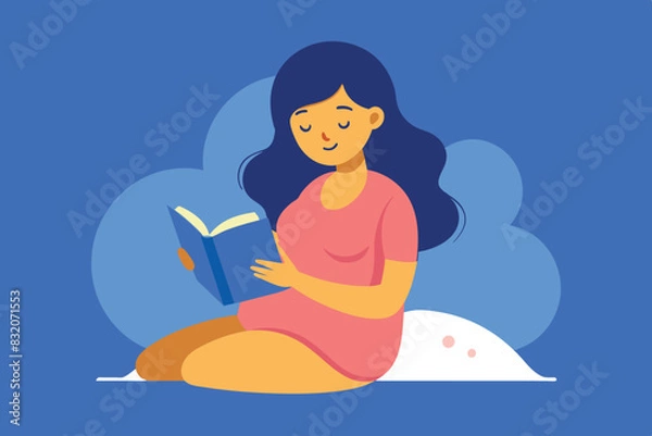 Fototapeta A pregnant girl sits on a bed by the window at night and reads a book.  A small toy is lying on the bed. The scene conveys a cozy and peaceful atmosphere.