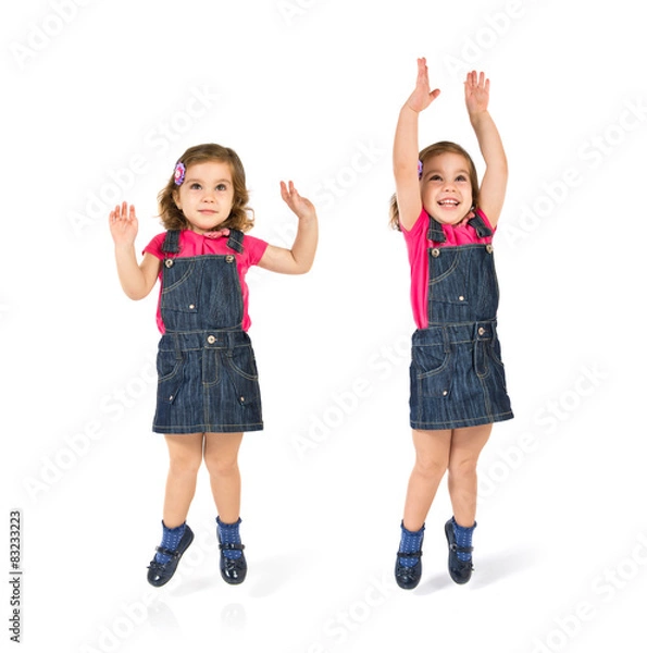 Obraz Kid jumping over isolated white background