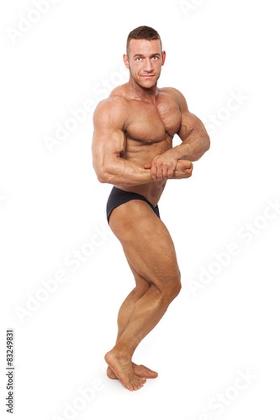 Obraz Bodybuilder posing isolated.